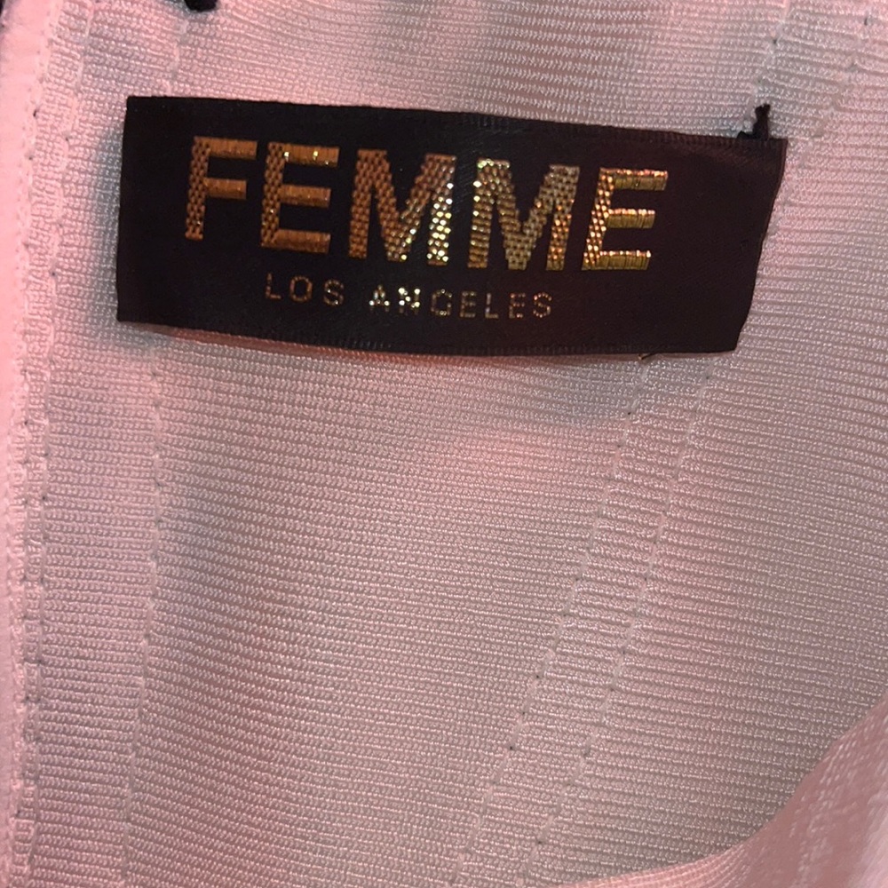 This dress is a size 2. The material is spandex with a back zipper